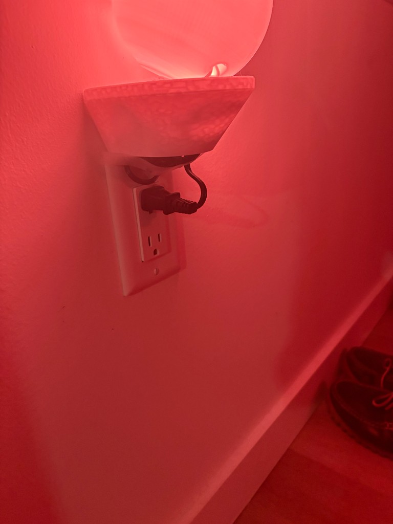 Printed orb night light plugged into a wall outlet
